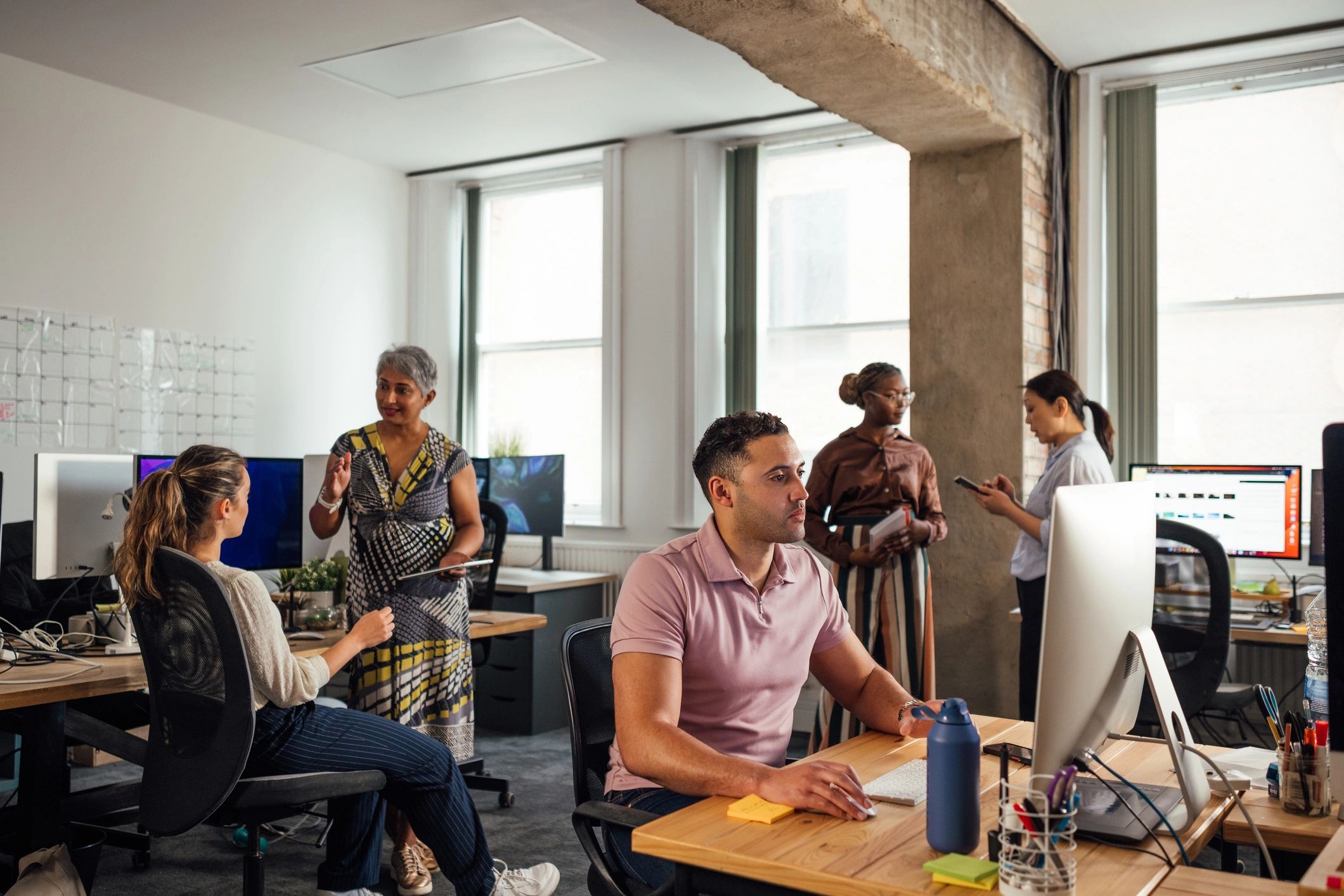 Small business team working on office computers