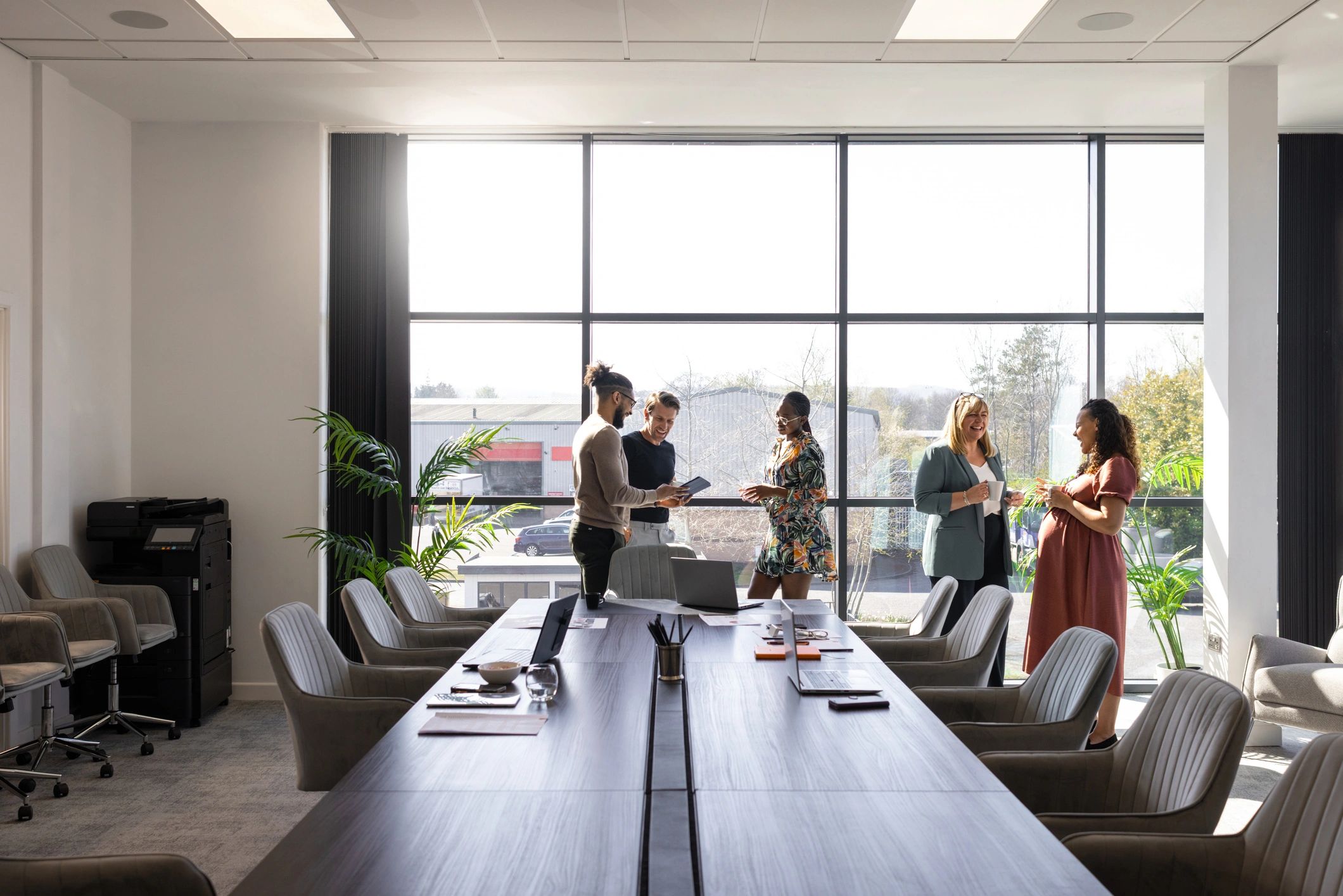 Dallas-area business team meeting in a modern office